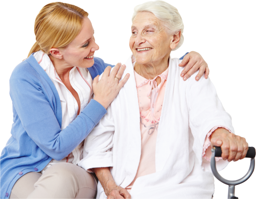Caregiver and an elder woman smiling at each other
